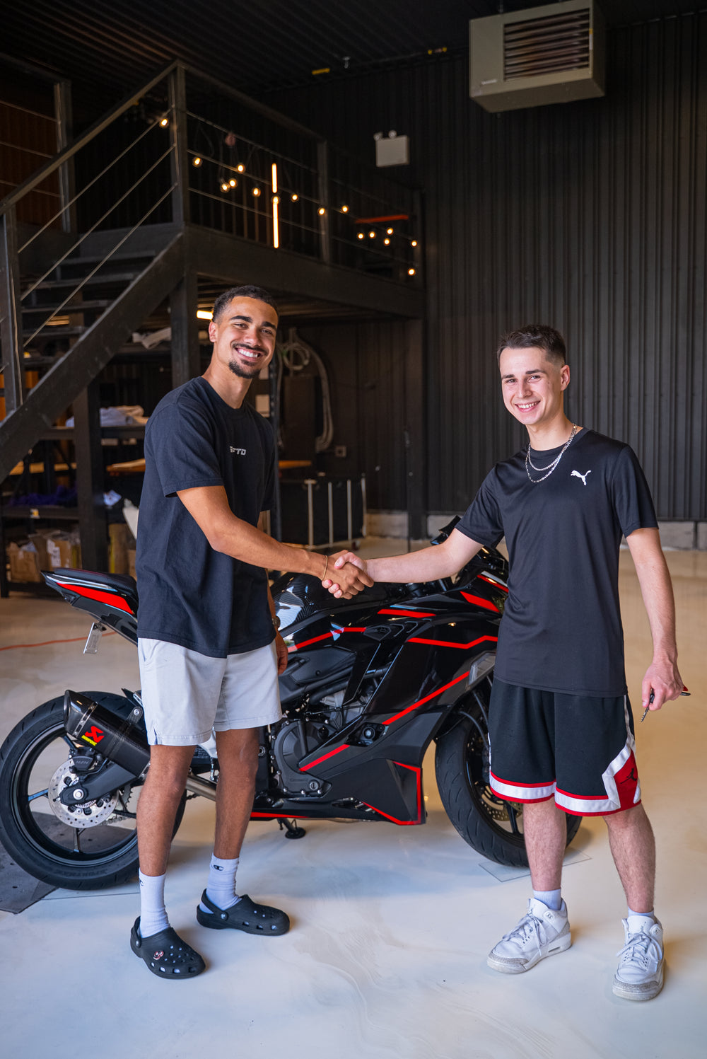 SBG001 winner Miguel S. shaking hands at the Kawasaki ZX-4RR handover